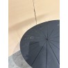 SECOND HAND - Ovoid side table with textured black matt top and black iron legs