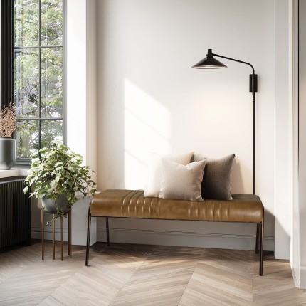 Brown leather upholstered bench with steel legs