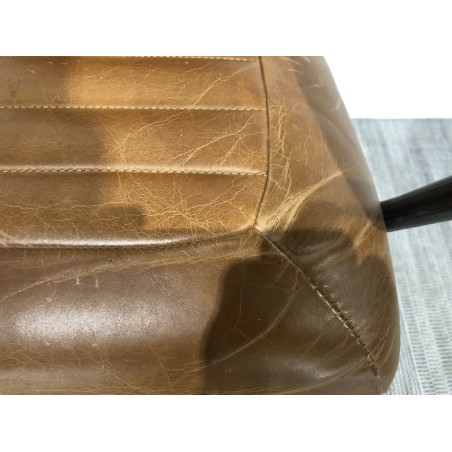 Vintage brown leather and black metal armchair with castors | Second-hand